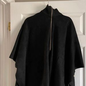A brand new with tags poncho. Faux suede. Perfect for now!